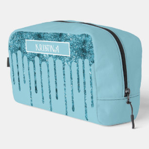 Sac de toilette bleu sarcelle pailleté sur fond bl