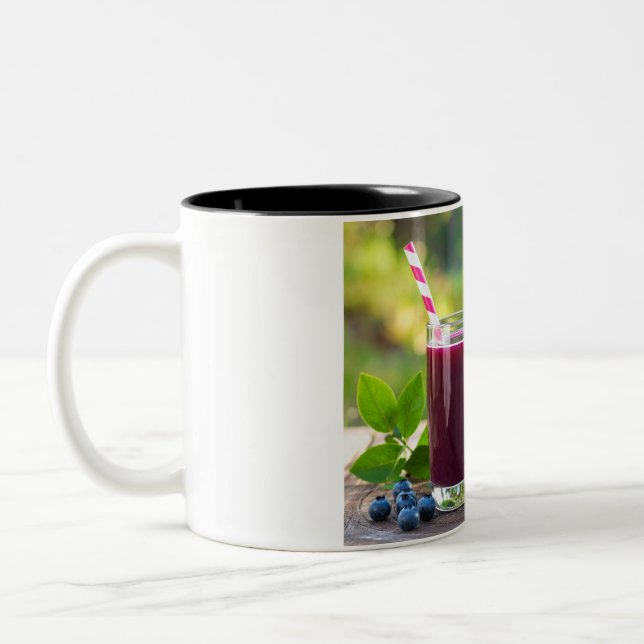 Saft mit Strohhalm Zweifarbige Tasse (Links)