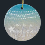 Sand Is The New Snow Beach Christmas Ornament<br><div class="desc">This fun beachliving design Sand is the new snow ornament feature a beach scene with a sea-star and string lights handing across the top. Personalize by adding a year.</div>