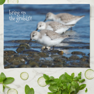 Sanderlings, die in gestaffelter Synchronizität fü Geschirrtuch