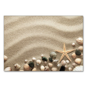 Sandstrand mit Muscheln und Starfish Tischnummer