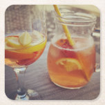 Sangria and Sunshine Rechteckiger Pappuntersetzer<br><div class="desc">This image shows a refreshing glass and pitcher of citrus sangria, perfect for a warm day. The fresh slices of lemon and orange add bright colour and hint of natural sweetness. One glass sits ready to enjoy while sangria is being poured from a small glass pitcher beside it, perfect for...</div>