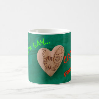 Sankt-Katze, die nach Plätzchen-Tasse sucht Kaffeetasse