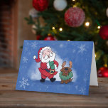 Santa Chocolate Labrador Rentier Joy Laughter Feiertagskarte<br><div class="desc">Dies ist eine großartige Weihnachtskarte, die man jedem schicken kann, um ein Lächeln auf das Gesicht zu legen, wie es der Weihnachtsmann in dieser Ferienzeit hier hat. Auf der Vorderseite der Karte ist eine Abbildung des Santa Lachen, während er darauf reagiert, seinen schokoladenbraunen Labrador mit einem Urlaubskrez um den Hals...</div>