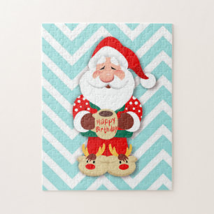 Santa Claus in red pajamas holding a mug
