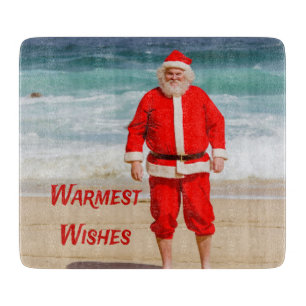Santa Clause am Strand Warmest wünscht einen sonni Schneidebrett