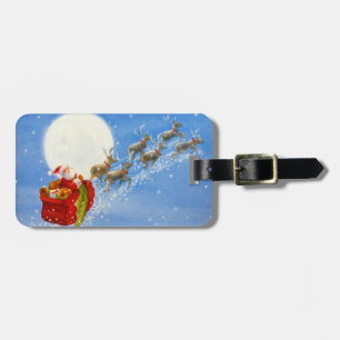 Santa mit seinem fliegenden Rentier-Gepäckanhänger Gepäckanhänger