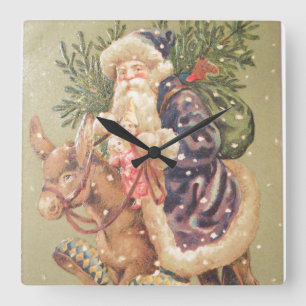Santa reitet auf einem Esel Quadratische Wanduhr