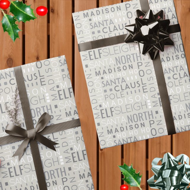 Santa Typografie Chic Gray Niedlich Add Kinder Nam Geschenkpapier (Add your child's name to this chic gray Christmas wrapping paper with a Santa typography design)