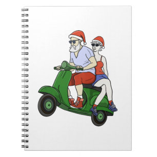 Santa und Frau Claus fahren mit einem Roller Notizblock