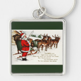 Santa und Sleigh mit Rentier Green Schlüsselanhänger