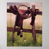 Sattel und Lasso auf Zaun