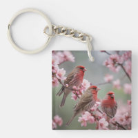 "Scarlet Trio: Rote Finken unter rosa Blüten"