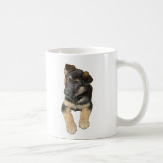 Schäferhundwelpe und -Sprichwort auf einer Tasse