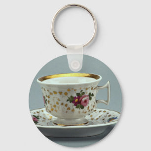 Schale und Saucer mit bunter Blume entwirft auf Schlüsselanhänger