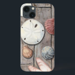 Schätze an der Küste iPhone 13 Hülle<br><div class="desc">Megan Meagher ist bekannt für ihre einfachen Kunstwerke. Dieses Bild zeigt die Einfachheit der Schätze der Küste,  einschließlich Sand Dollars und Muscheln in einem pastellfarbenen Ton. Meagher umschließt einen hölzernen Hintergrund in ihrem Bild,  um diese Schätze zu kontrastieren. Holen Sie sich diesen Kunstdruck heute auf Holzfarbe auf Ihrem Zazzle-Produkt.</div>