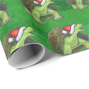 Schildkröte in der Weihnachtsmannmütze auf Grün Geschenkpapier