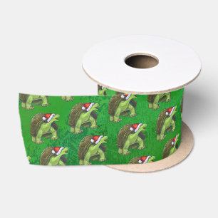 Schildkröte in der Weihnachtsmannmütze auf Grün Satinband