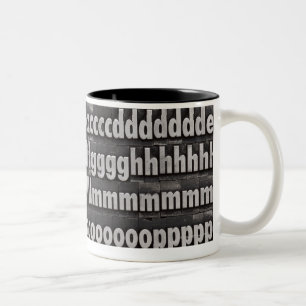 Schließen Sie Schriftart-Briefbeschwerer-Art ab Zweifarbige Tasse