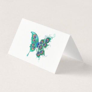 Schmetterling mit grünen Pfauenfedern