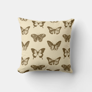 Schmetterlingskizze, schokoladenbraun auf Beige Kissen