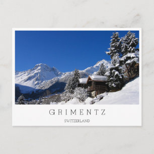 Schneebedeckte Blockhütten in der Schweiz Postkarte
