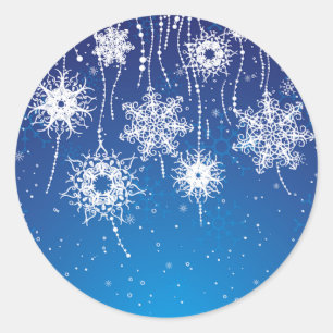 Schneeflocken auf blau runder aufkleber