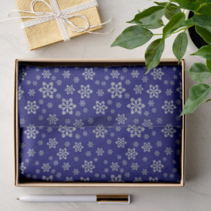 Schneeflocken auf blauem elegantem seidenpapier