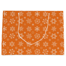 Schneeflocken auf Orange Weihnachtsgeschenktasche