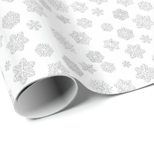 Schneeflocken des Weiß 3 d auf einem weißen Geschenkpapier