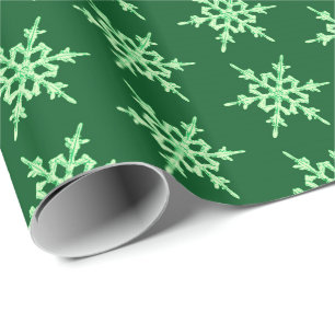 Schneeflocken, hellgrüne Kristalle auf dunkelgrü Geschenkpapier