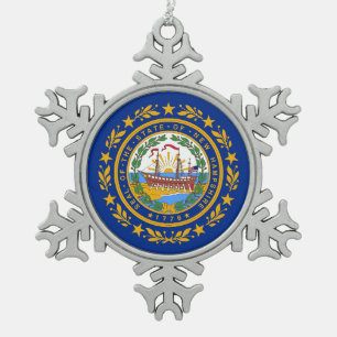 Schneeflocken mit der Fahne New Hampshire Zinn-Ornament