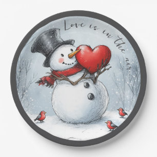 Schneemann bietet Liebe mit einem großen Herzen Pappteller