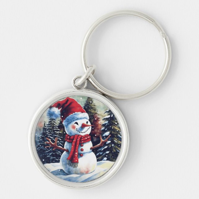 Schneemann mit rotem Heiß vor Bäumen Schlüsselanhänger (Vorne)