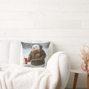 Schneemann schaufelt Schnee Kissen