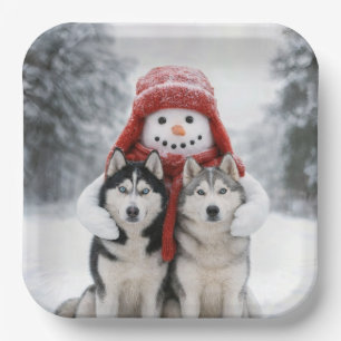 Schneemann umarmt sibirische Huskys Pappteller