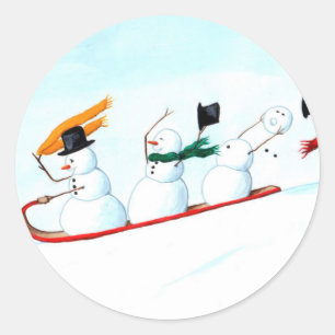 Schneemänner auf Schlitten Runder Aufkleber