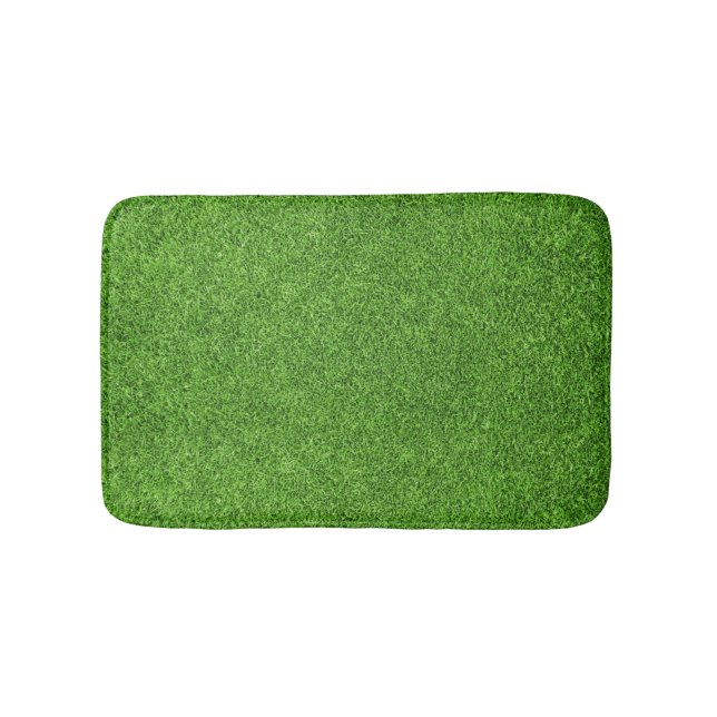 Schöne Beschaffenheit des grünen Grases vom Badematte (Vorderseite)