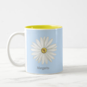Schöne Gänseblümchen-Blume auf Hellblau Zweifarbige Tasse