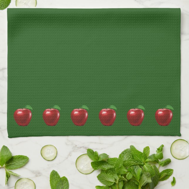Schöne rote Äpfel auf grünem Küchentuch (Gefaltet)
