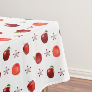 Schöne rote Äpfel und Apfelblüten auf Weiß Tischdecke