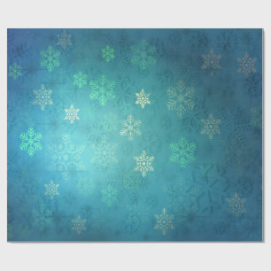 Schöne Schneeflocken auf Schatten von blau-grün Geschenkpapier