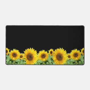 Schöne Sonnenblumen auf schwarz Schreibtischunterlage