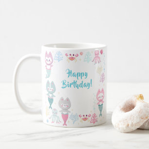Schöne Tasse mit niedlichen Meerjungfrauen.
