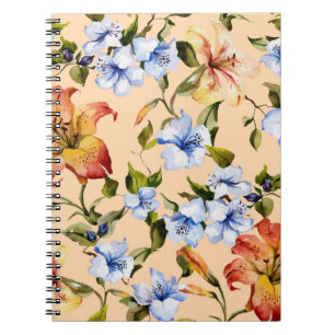 Schöne Tigerlilien und kleine blaue Blumen auf Notizblock