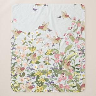 Schöner Kolibri in einer blumengeschmückten Blume Sherpadecke