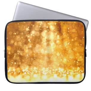 Schöner luxuriöser goldgelber Glitzer Hintergrund. Laptopschutzhülle