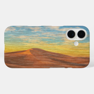 Schöner Sonnenaufgang über Sanddünen auf Holz iPhone 16 Hülle