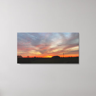 Schöner Sonnenuntergang über den Feldern Leinwanddruck