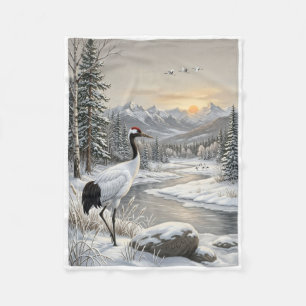 Schöner Vogel auf Felsen in schneereicher Winterla Fleecedecke